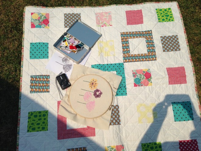 Embroidering in the Spring sun upon my Small Plates Lap Quilt